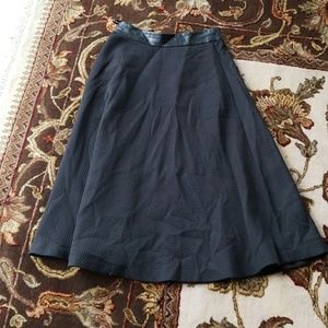 Gorgeous black midi skirt with leather detail